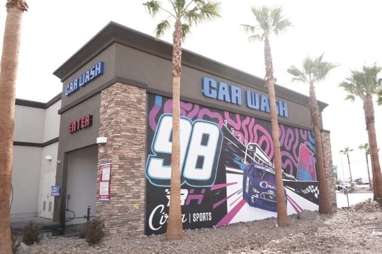 A terrible art mural of Riley's race car with the circa sports logo