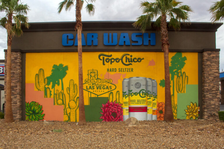 A terrible art mural of topo Chico seltzer